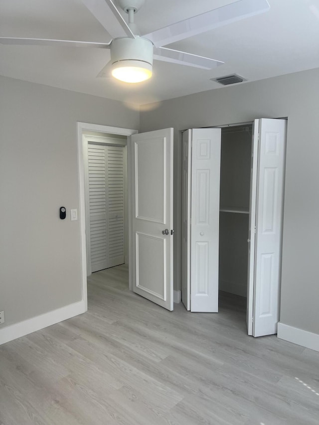 14910 Wildflower Ln, Delray Beach, FL 33446 - unfurnished bedroom featuring baseboards, light wood finished floors, a closet, and ceiling fan