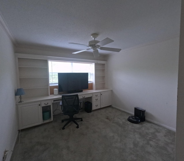 carpeted office featuring ceiling fan, a textured ceiling, and ornamental molding