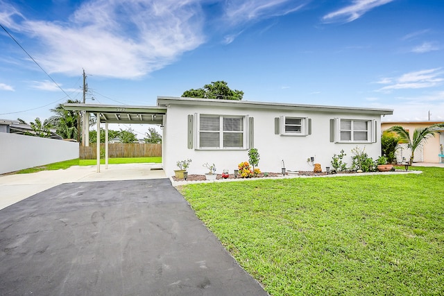 single story home with a front lawn