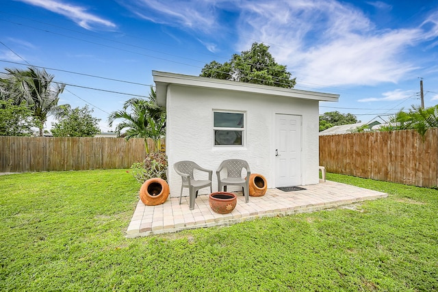 view of outdoor structure with a yard