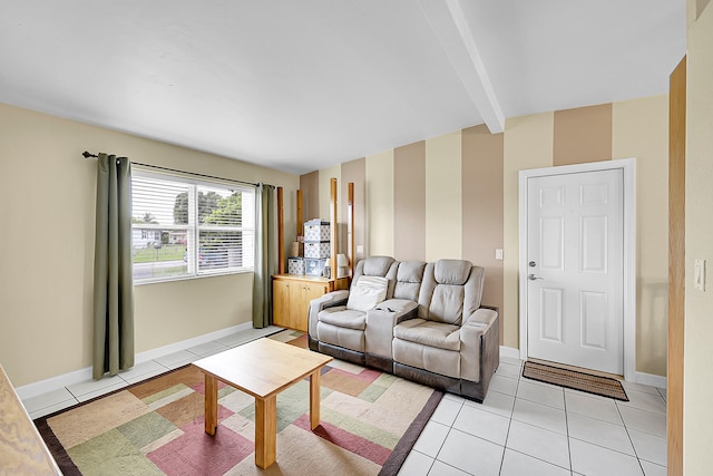 living room with beamed ceiling and light tile patterned floors