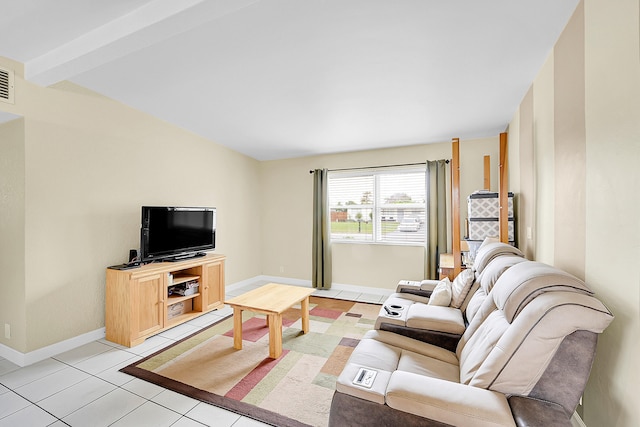 tiled living room featuring beamed ceiling