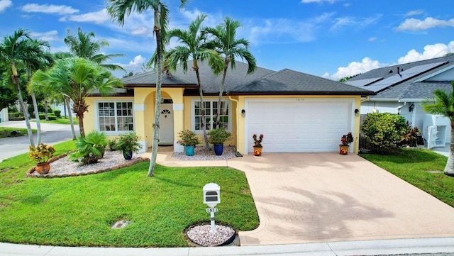 ranch-style house with a front lawn and a garage