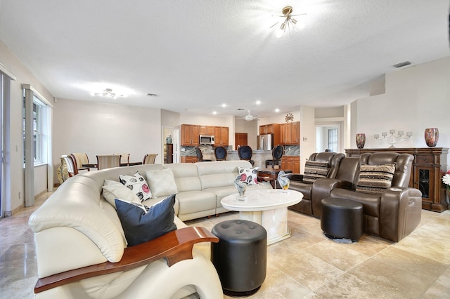 living room featuring a textured ceiling