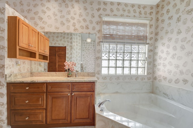 bathroom with vanity and tiled bath