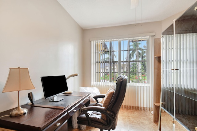 office featuring vaulted ceiling and light tile patterned floors