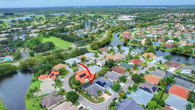 drone / aerial view with a water view