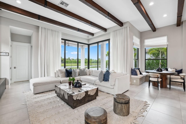 tiled living room with beamed ceiling