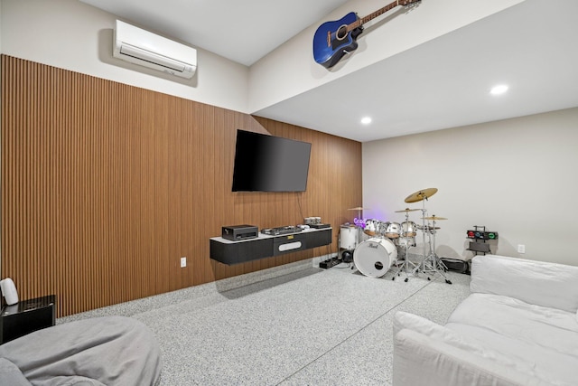 living room featuring an AC wall unit and wooden walls