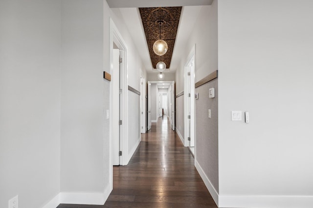 hallway featuring dark hardwood / wood-style flooring