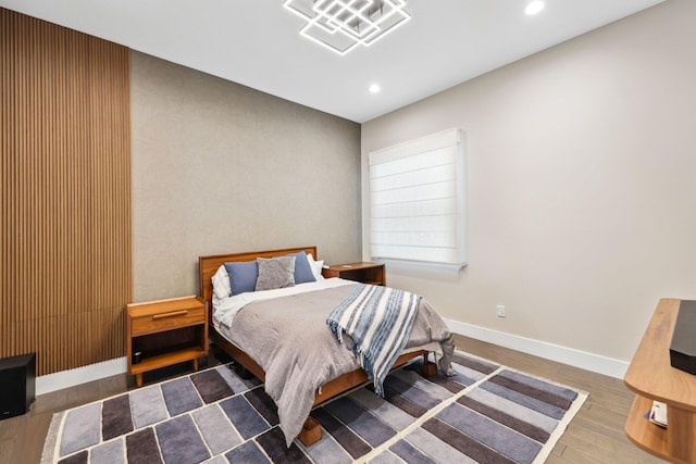 bedroom with dark wood-type flooring