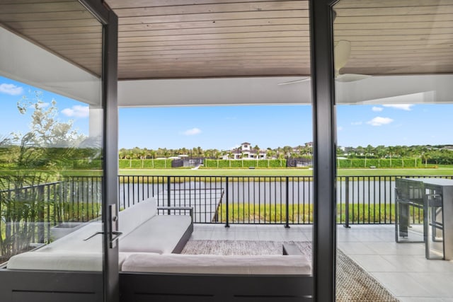 exterior space featuring a water view and outdoor lounge area