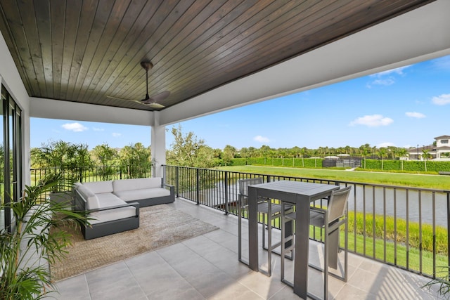 view of patio / terrace featuring an outdoor living space and a water view