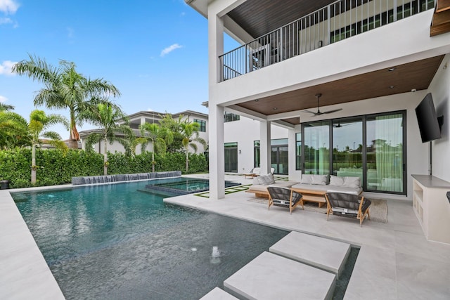 view of pool with a patio area, an outdoor living space, and ceiling fan