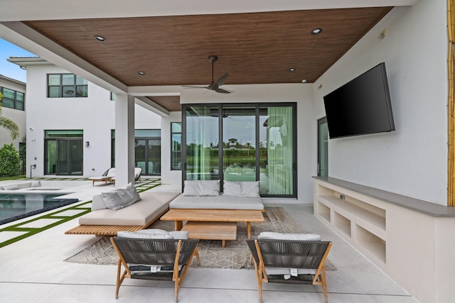 view of patio featuring an outdoor hangout area and ceiling fan