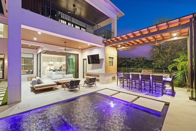 view of pool with an outdoor bar, a patio area, and outdoor lounge area