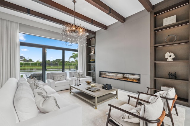 living room featuring beam ceiling, a chandelier, and built in features