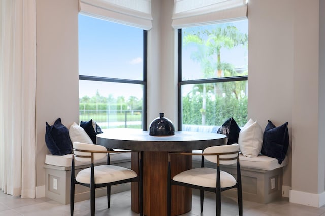 dining room with light tile patterned flooring