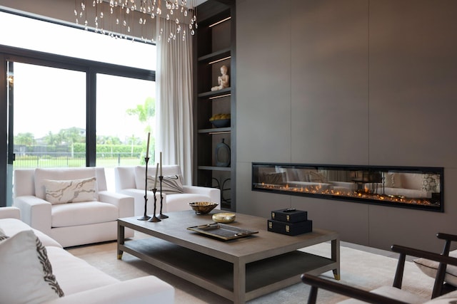 carpeted living room featuring built in shelves