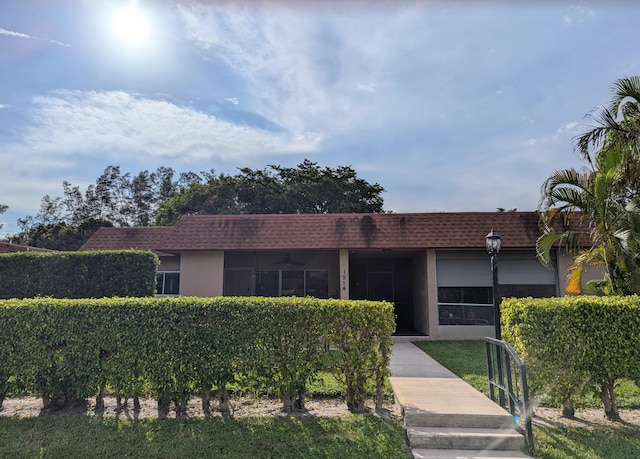 1914 Palmland Dr Unit B, Boynton Beach, FL 33436 - single story home featuring mansard roof, a ceiling fan, a shingled roof, and stucco siding