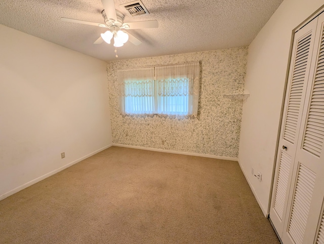 1914 Palmland Dr Unit B, Boynton Beach, FL 33436 - unfurnished bedroom featuring a closet, carpet floors, a textured ceiling, a ceiling fan, and baseboards