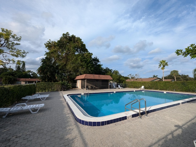 1914 Palmland Dr Unit B, Boynton Beach, FL 33436 - community pool with a patio and fence
