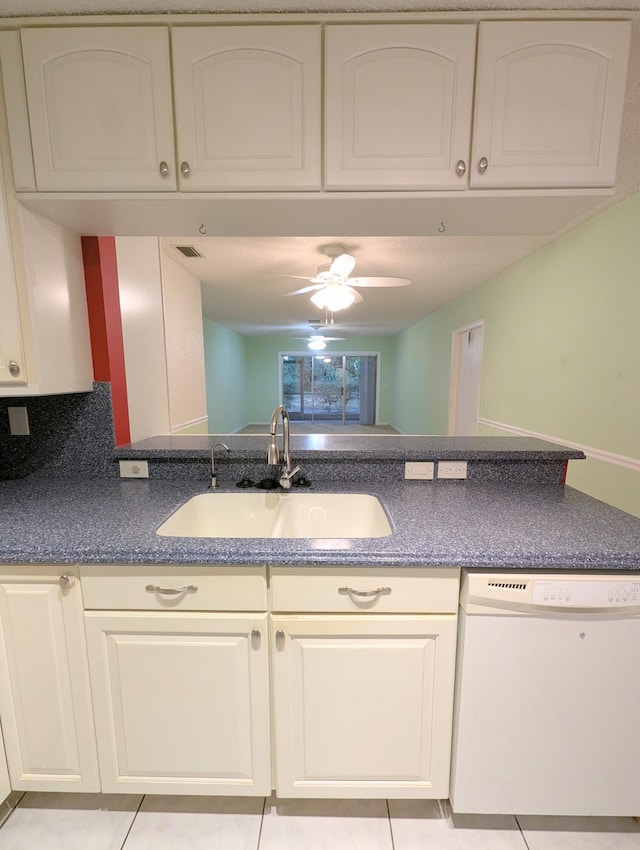 1914 Palmland Dr Unit B, Boynton Beach, FL 33436 - kitchen with white dishwasher, a sink, dark countertops, ceiling fan, and light tile patterned floors