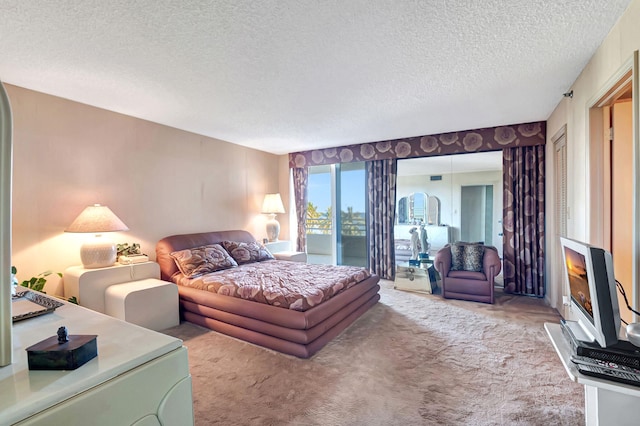 carpeted bedroom featuring a textured ceiling and a fireplace