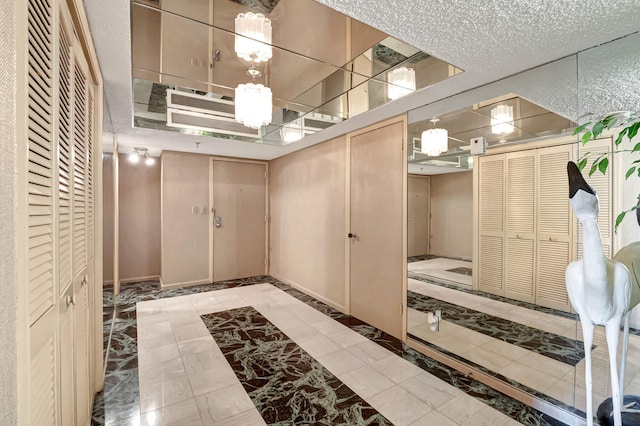 interior space featuring a textured ceiling