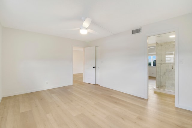 empty room with light hardwood / wood-style floors and ceiling fan