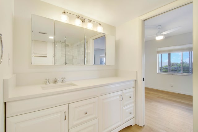 bathroom with vanity, an enclosed shower, hardwood / wood-style flooring, and ceiling fan