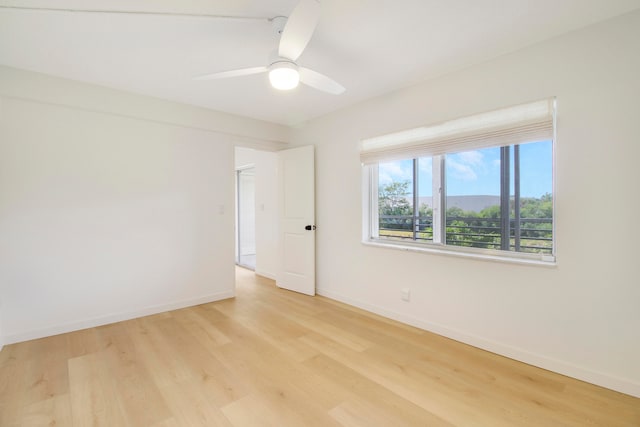 unfurnished room with light hardwood / wood-style floors and ceiling fan