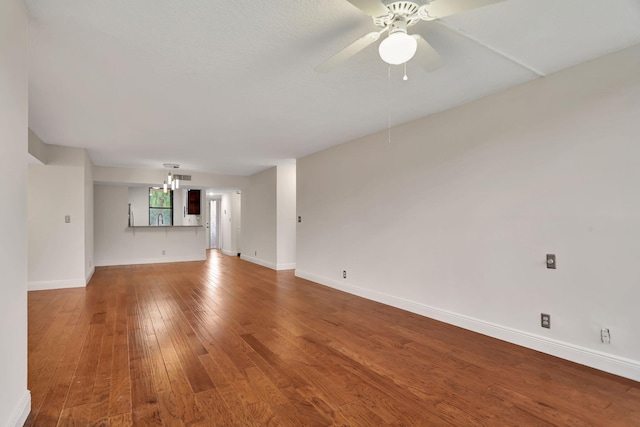 unfurnished living room with hardwood / wood-style floors and ceiling fan