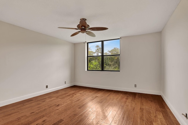 unfurnished room featuring hardwood / wood-style floors and ceiling fan