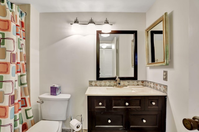 bathroom with toilet, a shower with curtain, backsplash, and vanity