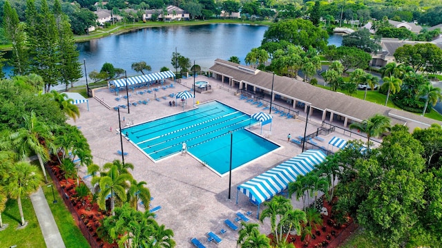 view of swimming pool featuring a water view