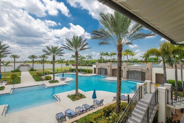 view of swimming pool featuring a patio area and pool water feature