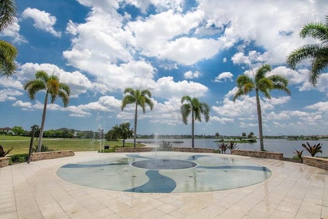 view of swimming pool with a water view