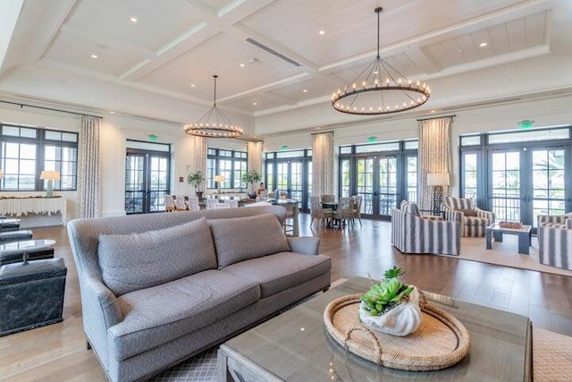 living room featuring french doors and a healthy amount of sunlight