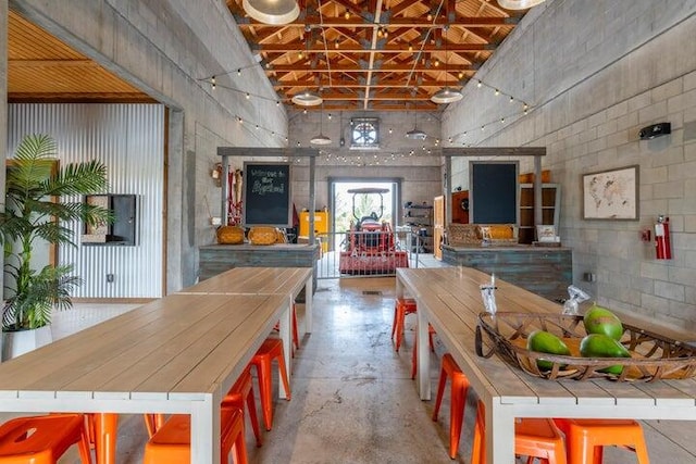 kitchen with concrete floors and a kitchen bar