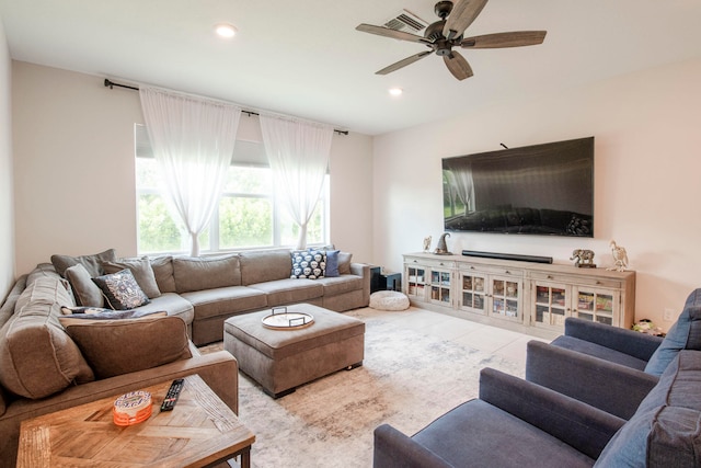 living room with ceiling fan and light tile patterned floors