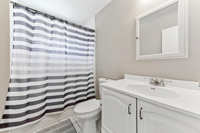 bathroom with tile patterned flooring, vanity, and toilet