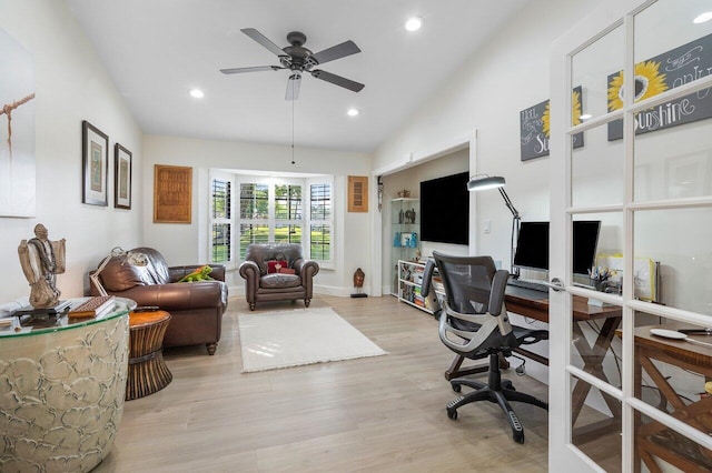 office area with ceiling fan, lofted ceiling, and light wood-type flooring