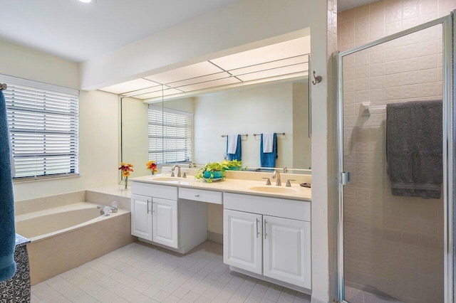 bathroom featuring vanity, separate shower and tub, and tile patterned floors