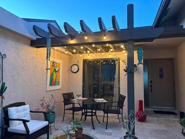 view of patio terrace at dusk