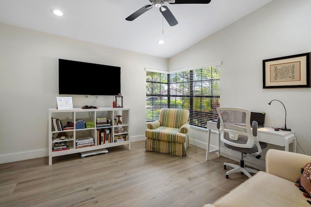 office featuring vaulted ceiling, light hardwood / wood-style flooring, and ceiling fan