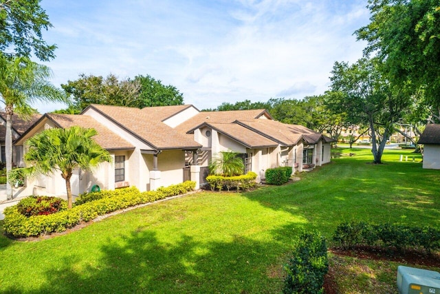 ranch-style home featuring a front lawn