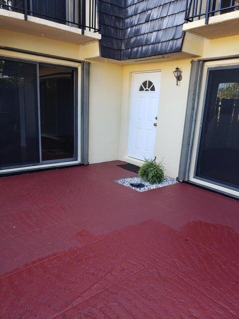 doorway to property with a patio area