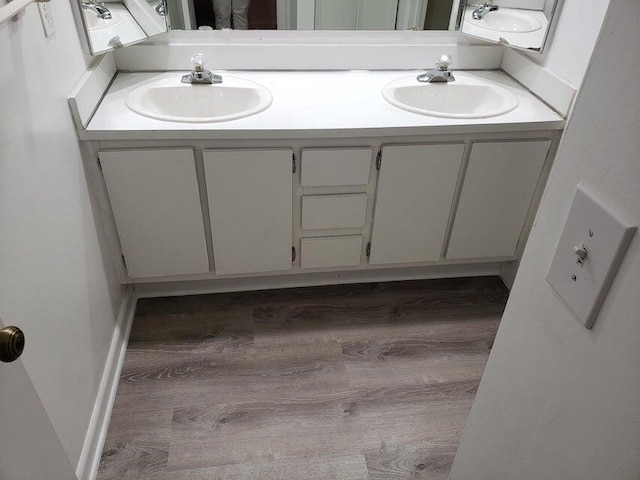 bathroom featuring vanity and wood-type flooring