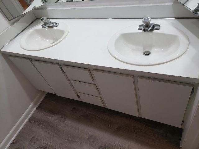 bathroom with vanity and hardwood / wood-style floors